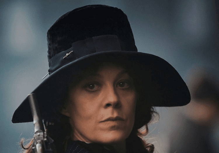aunt polly dressed in black with a matching hat