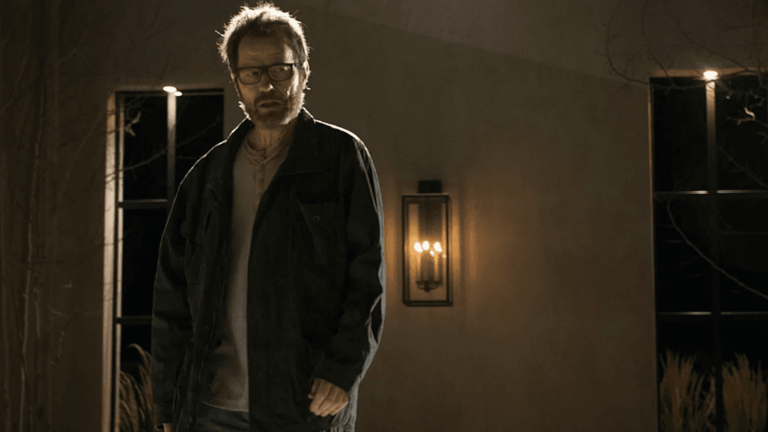 walter white standing still in a black jacket