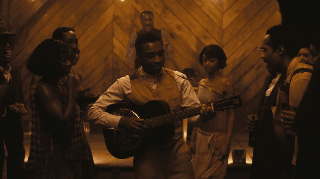 Sammie Playing Blues on a guitar